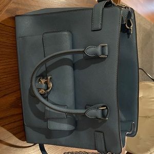 Large denim colored purse with shoulder strap. Looks brand new.